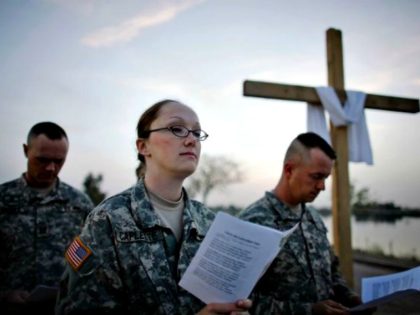 Soldiers Pray Cross Dusan VranicAP