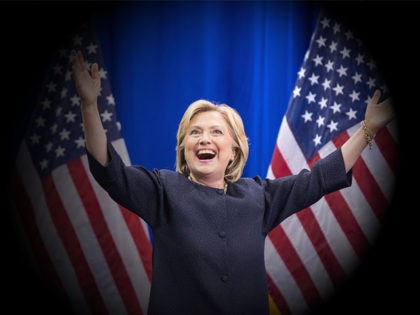 MANCHESTER, NH - SEPTEMBER 19: Democratic presidential candidate Hillary Clinton raises he