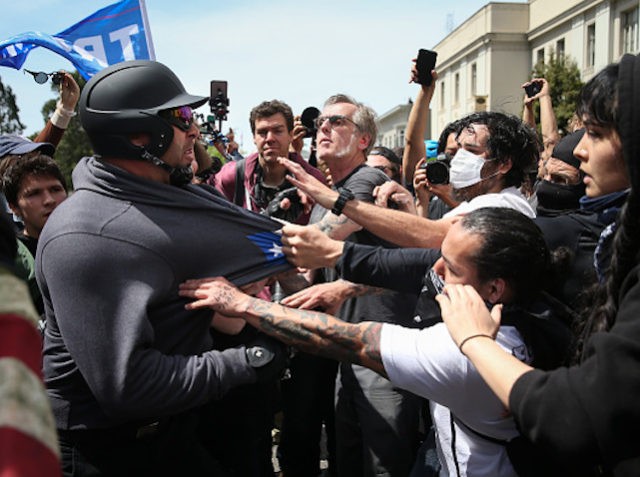 BERKELEY, CA - APRIL 15: Trump supporters clash with protesters at a "Patriots Day" free speech rally on April 15, 2017 in Berkeley, California. More than a dozen people were arrested after fistfights broke out at a park where supporters and opponents of President Trump had gathered. (Photo by Elijah …