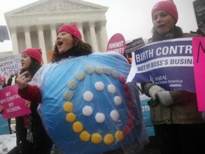 Margot Riphagen of New Orleans, La., wears a birth control pills costume as she protests in front of the Supreme Court in Washington, Tuesday, March 25, 2014, as the court heard oral arguments in the challenges of President Barack Obama's health care law requirement that businesses provide their female employees …