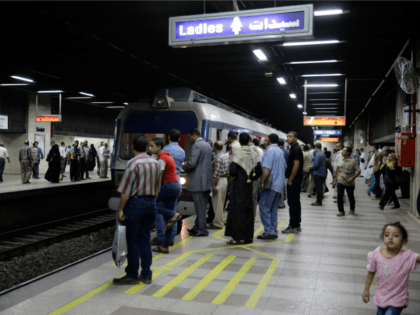Passengers prepare to embark an arriving train at the Sadat metro station located beneath Tahrir Square, in Cairo, Egypt, Wednesday, June 17, 2015. Sadat station, one of Cairo's largest, re-opened after nearly two years of closure for security reasons. The sprawling underground station is one of only two stations where …