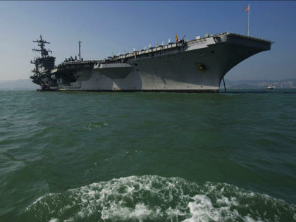 The USS Carl Vinson, a US nuclear powered aircraft carrier, is seen in Hong Kong waters on December 27, 2011. The USS Carl Vinson, which was commissioned in 1982, is in Hong Kong for a three day visit. AFP PHOTO / AARON TAM (Photo credit should read aaron tam/AFP/Getty Images)