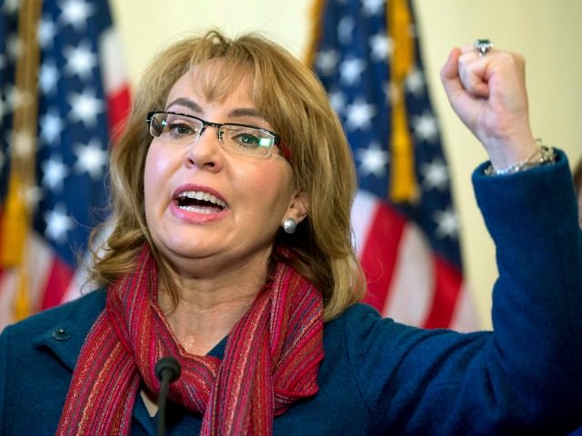 In this March 4, 2015 file photo, former U.S. Rep. Gabby Giffords, D-Ariz., speaks on Capitol Hill in Washington about bipartisan legislation on gun safety. The gun safety group founded by former congresswoman Giffords has recruited an unlikely ally: a group of former high-level military officials. The political action committee …