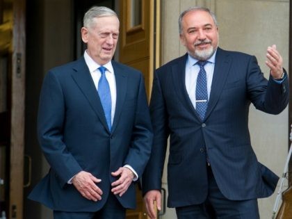 Defense Secretary Jim Mattis, left, welcomes Israeli Defense Minister Avigdor Lieberman to the Pentagon Tuesday, March 7, 2017. (AP Photo/Cliff Owen)