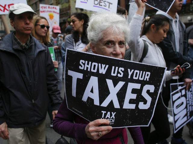 Protestors take part in the 'Tax March' calling on US President Donald Trump to release his tax records on April 15, 2017 in New York Thousands of protesters gathered Saturday, April 15, 2017 in cities across the United States to pressure President Donald Trump to release his tax returns, a …