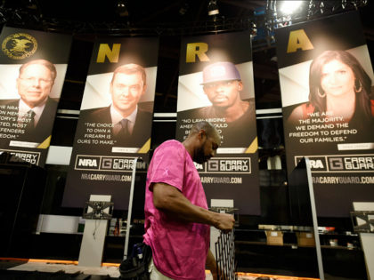 Be Ware, of Atlanta works on a vendor booth ahead of the NRA convention, Thursday, April 27, 2017, in Atlanta. The NRA is holding its 146th annual meetings and exhibits forum at the Georgia World Congress Center with President Donald Trump slated to speak Friday. (AP Photo/Mike Stewart)