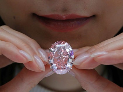 The Pink Star diamond, the most valuable cut diamond ever offered at auction, is displayed by a model at a Sotheby's auction room in Hong Kong, Wednesday, March 29, 2017. It is the largest internally flawless fancy vivid pink diamond ever graded by the GIA. The diamond estimated in excess …