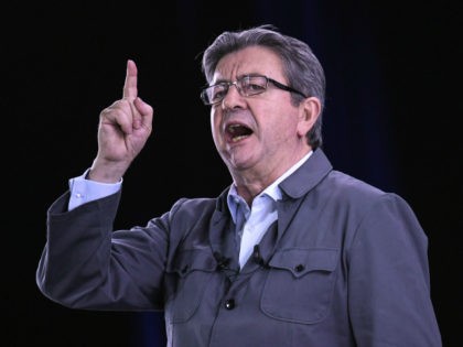French presidential election candidate for the far-left coalition La France insoumise Jean-Luc Melenchon delivers a speech on stage during a campaign meeting, as his hologram appears at events in six other cities, on April 18, 2017 in Dijon, central France. Melenchon holds a meeting in Dijon as his holograms appear …