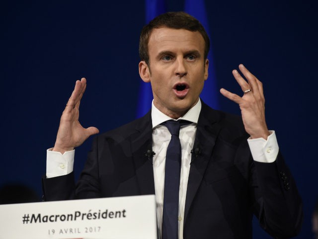 French presidential election candidate for the En Marche ! movement Emmanuel Macron gestur