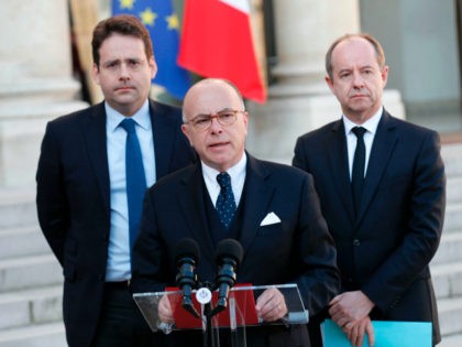 French Prime Minister Bernard Cazeneuve speaks next to Interior Minister Matthias Fekl (L)