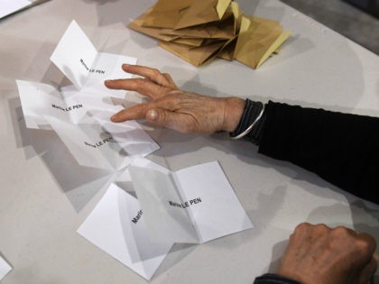 Volunteers count the ballots at the end of the first round of the French presidential elec