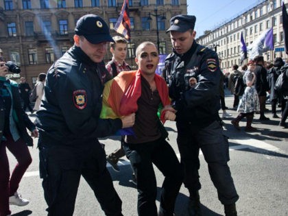Police detain a gay rights activist during May Day demonstration in Saint Petersburg, Russ
