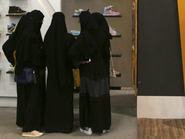 In this Friday, Dec. 11, 2015 photo, Saudi women shop at a mall in Riyadh, Saudi Arabia. W