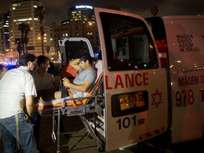 A wounded man is evacuated from the scene of a stabbing attack in Jaffa, a mixed Jewish-Arab part of Tel Aviv, Israel, Tuesday, March 8, 2016. (AP Photo/Oded Balilty)