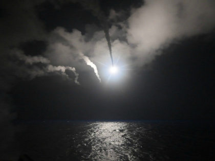 FILE - In this file image provided on Friday, April 7, 2017 by the U.S. Navy, the guided-missile destroyer USS Porter (DDG 78) launches a tomahawk land attack missile in the Mediterranean Sea. The U.S. missile attack has caused heavy damage to one of Syria's biggest and most strategic air …