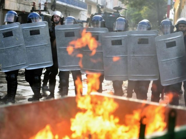 Paraguay's riot police clash with protesters against the Congress building in Asuncion, on