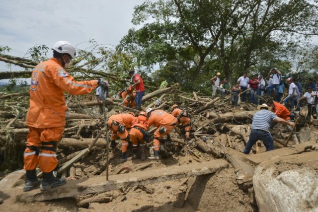Rescuers search for victims following deadly mudslides in Mocoa, southern Colombia on Apri