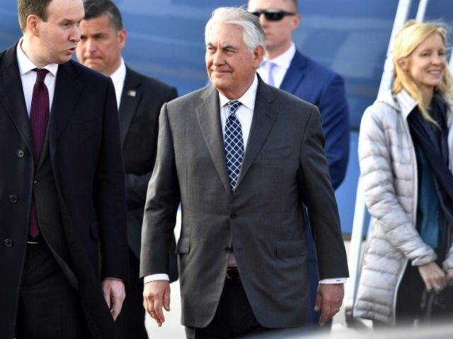 US Secretary of State Rex Tillerson (C) walks upon his arrival at the Vnukovo II Governmen