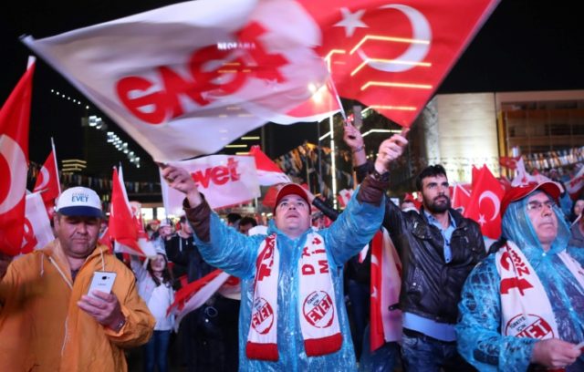 Supporters of Turkish President Recep Tayyip Erdogan celebrate as the 'Yes' camp claims vi