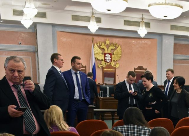 Participants attend a hearing on the justice ministry request to ban the Jehovah's Witnesses at Russia's Supreme Court in Moscow on April 20, 2017