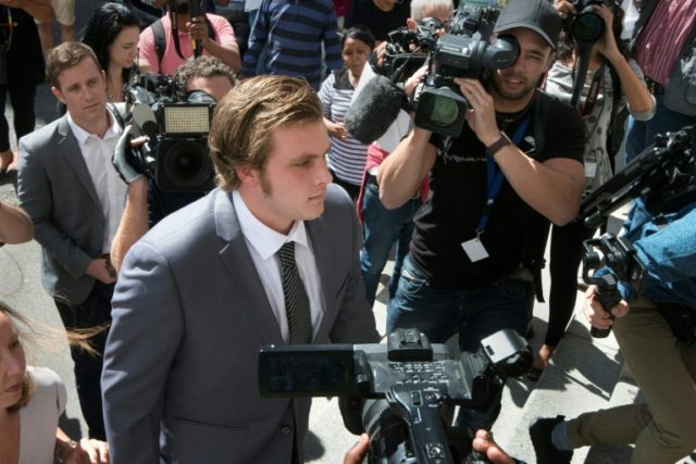 Henri van Breda (C) is alleged to have killed his brother and parents and left his sister