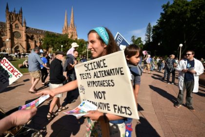 Supporters of science and research prepare to hand out leaflets as part of the March for S