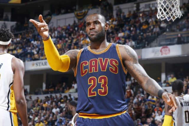 LeBron James of the Cleveland Cavaliers reacts after a basket and foul against the Indiana