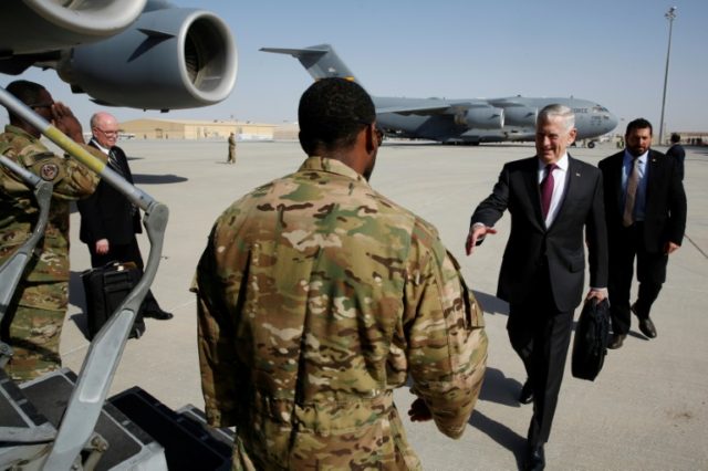 US Defence Secretary James Mattis (right) flew from Qatar where he was on a regional tour