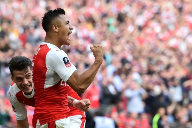 Arsenal's striker Alexis Sanchez (R) celebrates scoring against Manchester City at Wembley