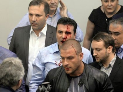 Opposition Social Democrats leader Zoran Zaev bleeding after being injured when supporters of Macedonia's former leading party entered the parliament and attacked MPs