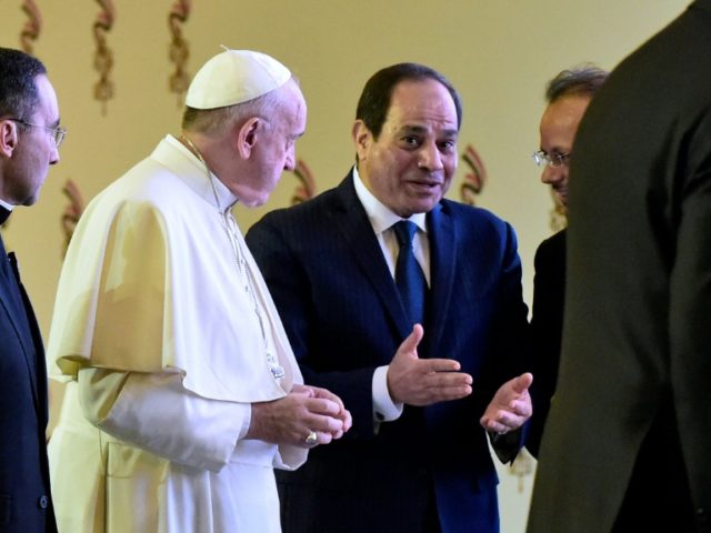 Pope Francis and Egyptian President Abdel Fattah al-Sisi chat with officials after meeting