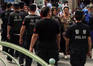 China punishes 97 officers for failing to crack down on Muslims