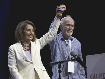 Rep. Nancy Pelosi, D-Calif., and California Democratic Party Chairman John Burton raise th