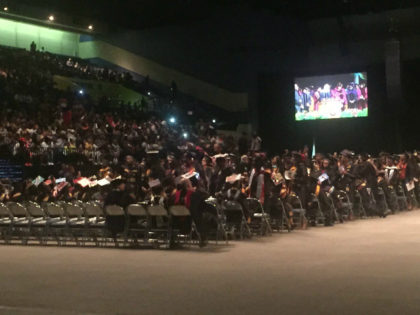Many of the 300 graduates of historically black college Bethune-Cookman University turned their backs on U.S. Education Secretary Betsy DeVos as she gave her first commencement address since assuming her post.