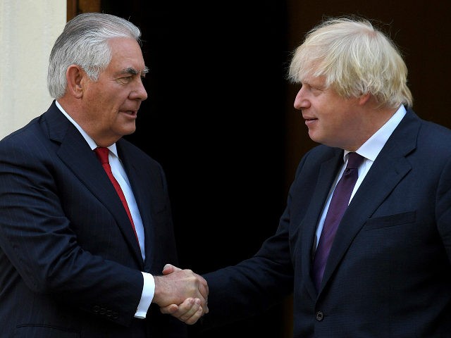 Britain's Foreign Secretary Boris Johnson, right, shakes hands with US Secretary of State,