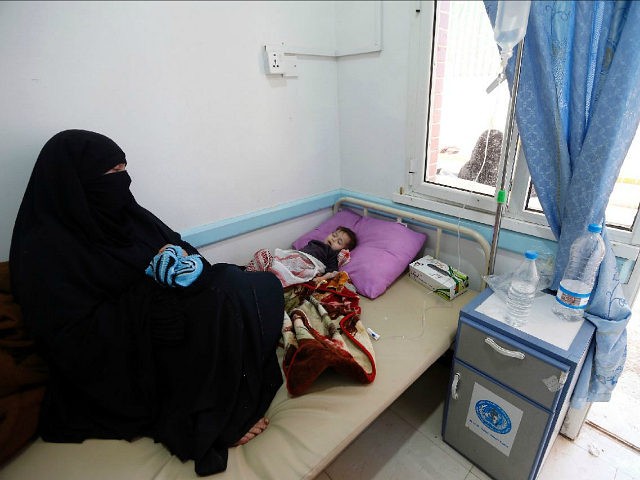 A Yemeni child, suspected of being infected with cholera, receives treatment at a hospital