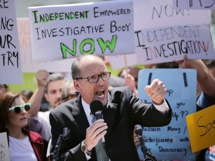 Democratic National Party Chirman Tom Perez speaks as people rally to protest against Pres