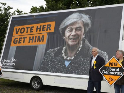 Liberal Democrat politician Vince Cable poses for a photograph after unveiling a campaign poster featuring a combined image of Nigel Farage and Theresa May at Twickenham Rugby Football Club in south west London on May 20, 2017. Cable, former Liberal Democrat Shadow Chancellor and former Business Secretary is looking to …