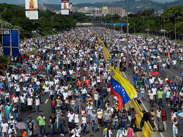 Opposition activists block the Francisco Fajardo main motorway in eastern Caracas on May 2