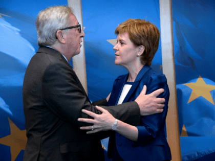 European Union Commission President Jean-Claude Juncker (L) welcomes Scotland's First Minister and Leader of the Scottish National Party Nicola Sturgeon before their meeting at the European Union Commission headquarter in Brussels, June 29, 2016. (Photo by THIERRY CHARLIER/AFP/Getty Images)