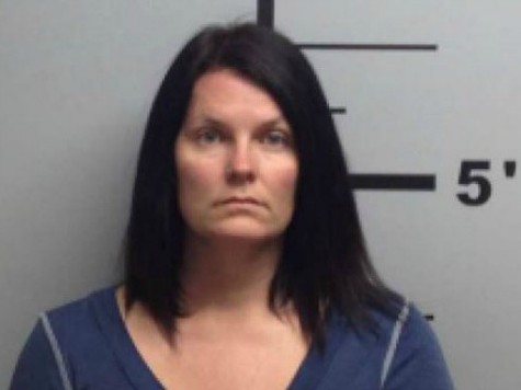 Kerrie Lenkerd, an Arkansas woman, reportedly claims she fired a warning shot after lookin