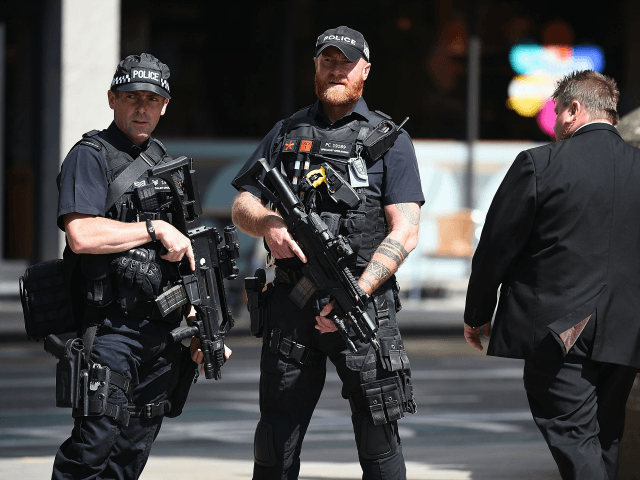 Police stand guard near the Manchester Arena on May 23, 2017 in Manchester, England.