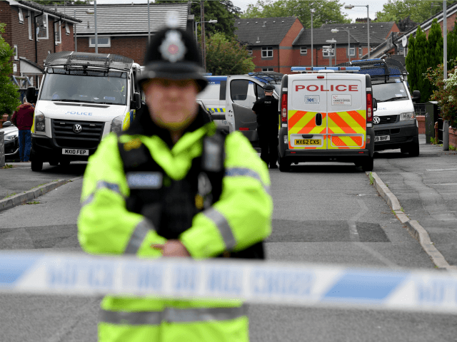 Police close the road leading to Quantock Street in the Moss Side area of Manchester where a raid was carried out earlier on May 28, 2017 in Manchester, England. (Photo by Anthony Devlin/Getty Images)