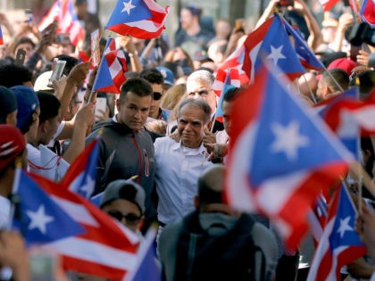 FILE - In this May 18, 2017 file photo, Puerto Rican nationalist Oscar Lopez Rivera, cente