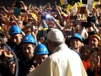 TOPSHOT-ITALY-VATICAN-POPE-VISIT TOPSHOT - Pope Francis is welcomed and photographed upon his arrival for a meeting with workers of the Ilva steel plant as part of a one-day visit in Genoa, on May 27, 2017. / AFP PHOTO / Andreas SOLARO (Photo credit should read ANDREAS SOLARO/AFP/Getty Images)