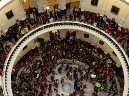 Protesters in Texas Capitol Rotunda about sanctuary city law.
