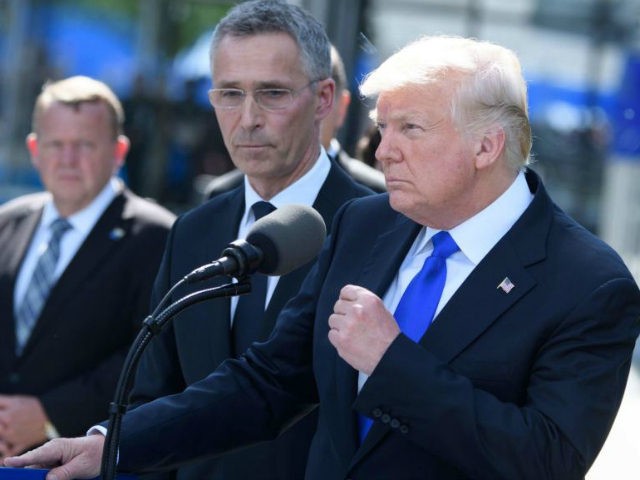 US President Donald Trump delivers a speech during the unveiling ceremony of the new NATO