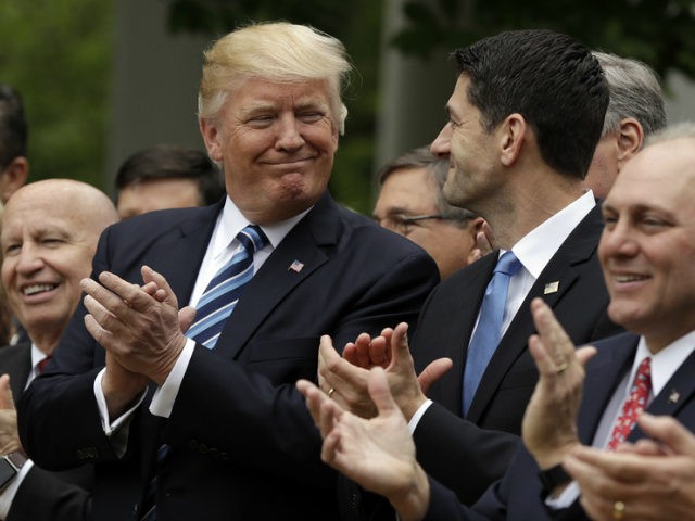 President Donald Trump talks with House Speaker Paul Ryan of Wis., in the Rose Garden of t