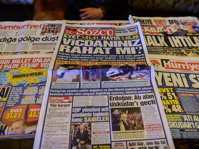 CORRECTION - This picture taken in Istanbul on April 17, 2017, shows the front pages of Tu