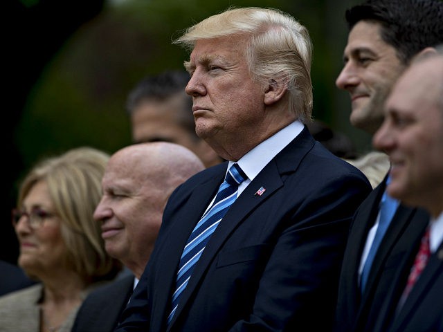 U.S. President Donald Trump, center, listens during a press conference in the Rose Garden of the White House in Washington, D.C., U.S., on Thursday, May 4, 2017. House Republicans mustered just enough votes to pass their health-care bill Thursday, salvaging what at times appeared to be a doomed mission to …